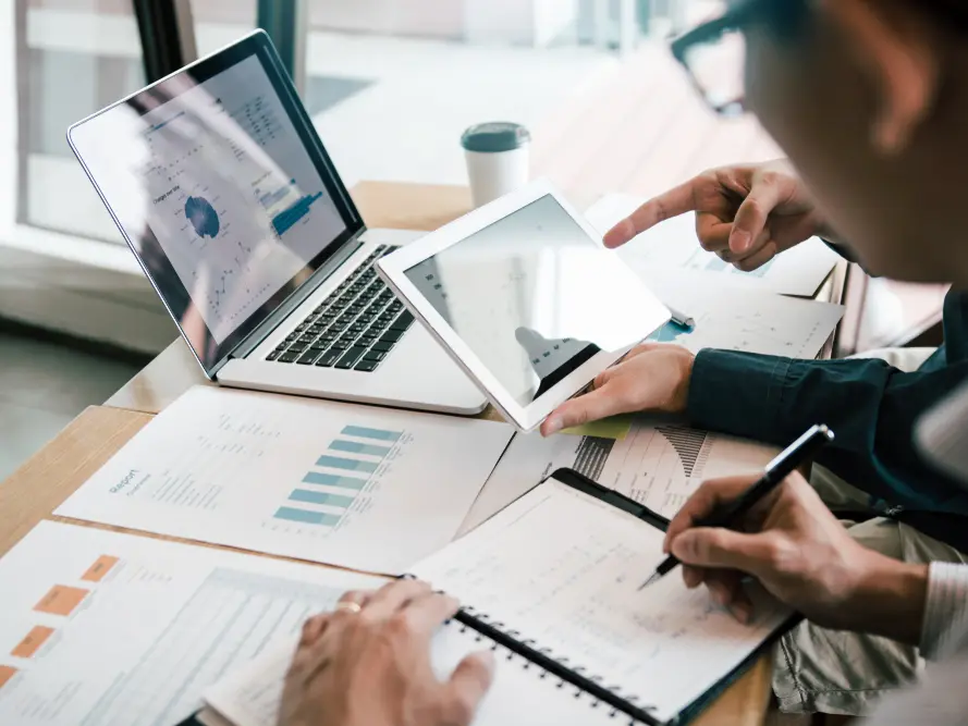 Team in discussion about spreadsheets