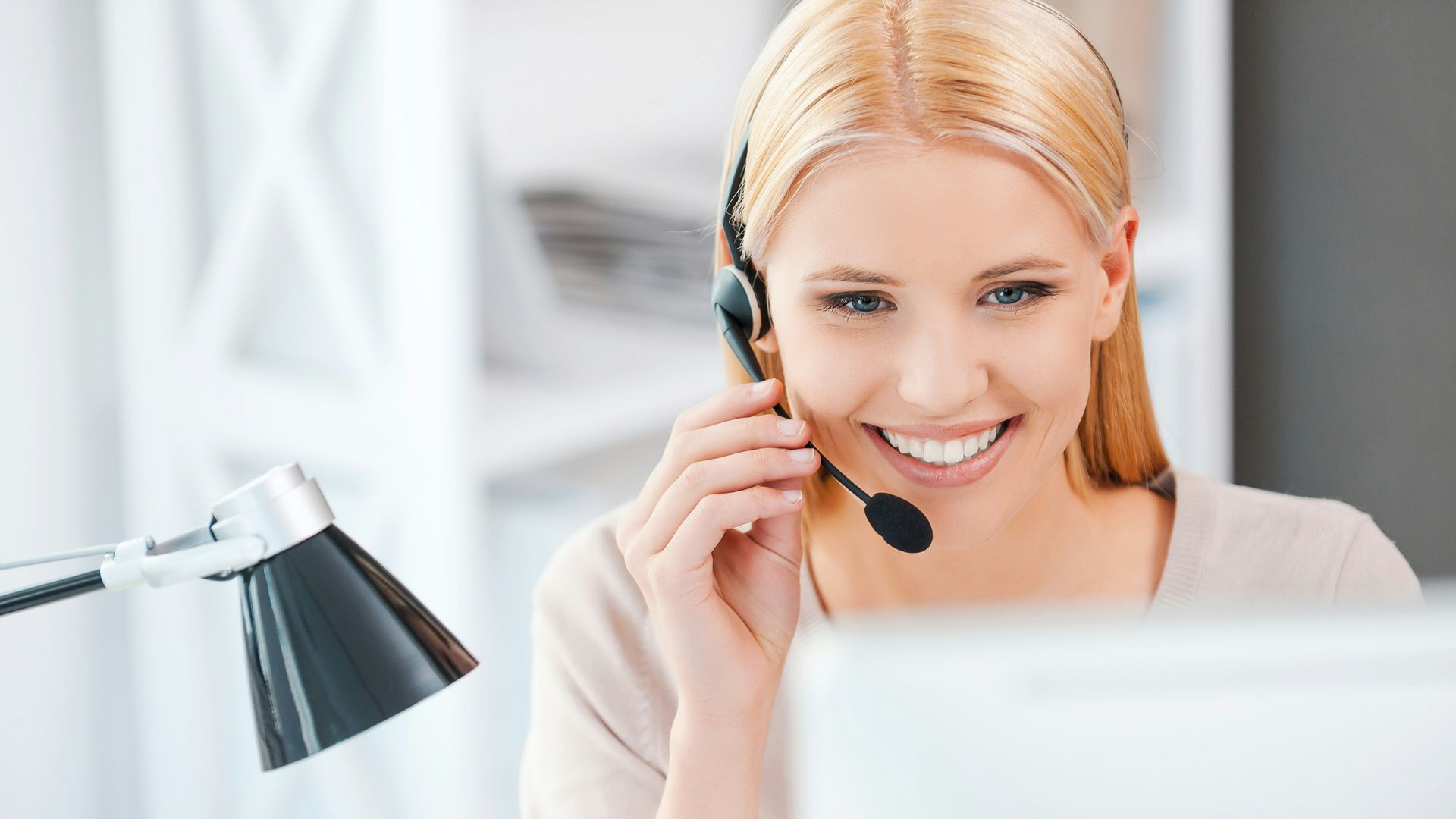odoo support happy young woman working at the computer